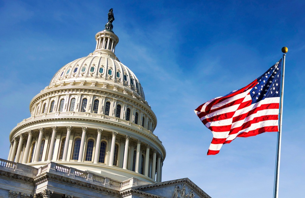 capital building with raised american flag